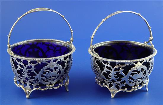 A matched pair of early 20th century silver tub shaped sugar baskets, 7 oz.